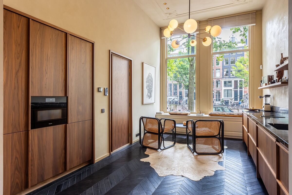 A Luxurious Apartment in an Amsterdam Canal House 8 kitchen with built in cabinets and window seating