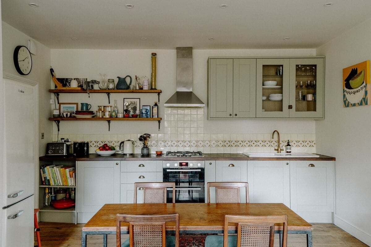 A Charming Apartment in a Victorian Villa 3 kitchen with dining table and shelves