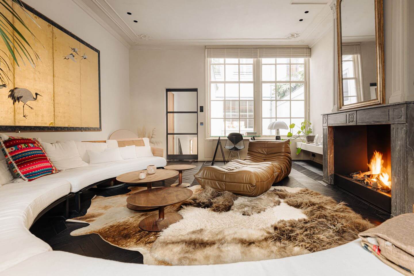 A Luxurious Apartment in an Amsterdam Canal House 13 large curved sofa fireplace