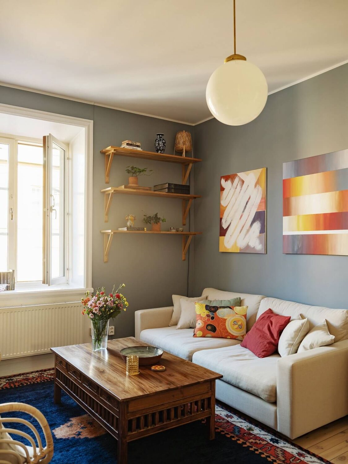 A Light Apartment with a Sunny Balcony 3 light living room blue rug
