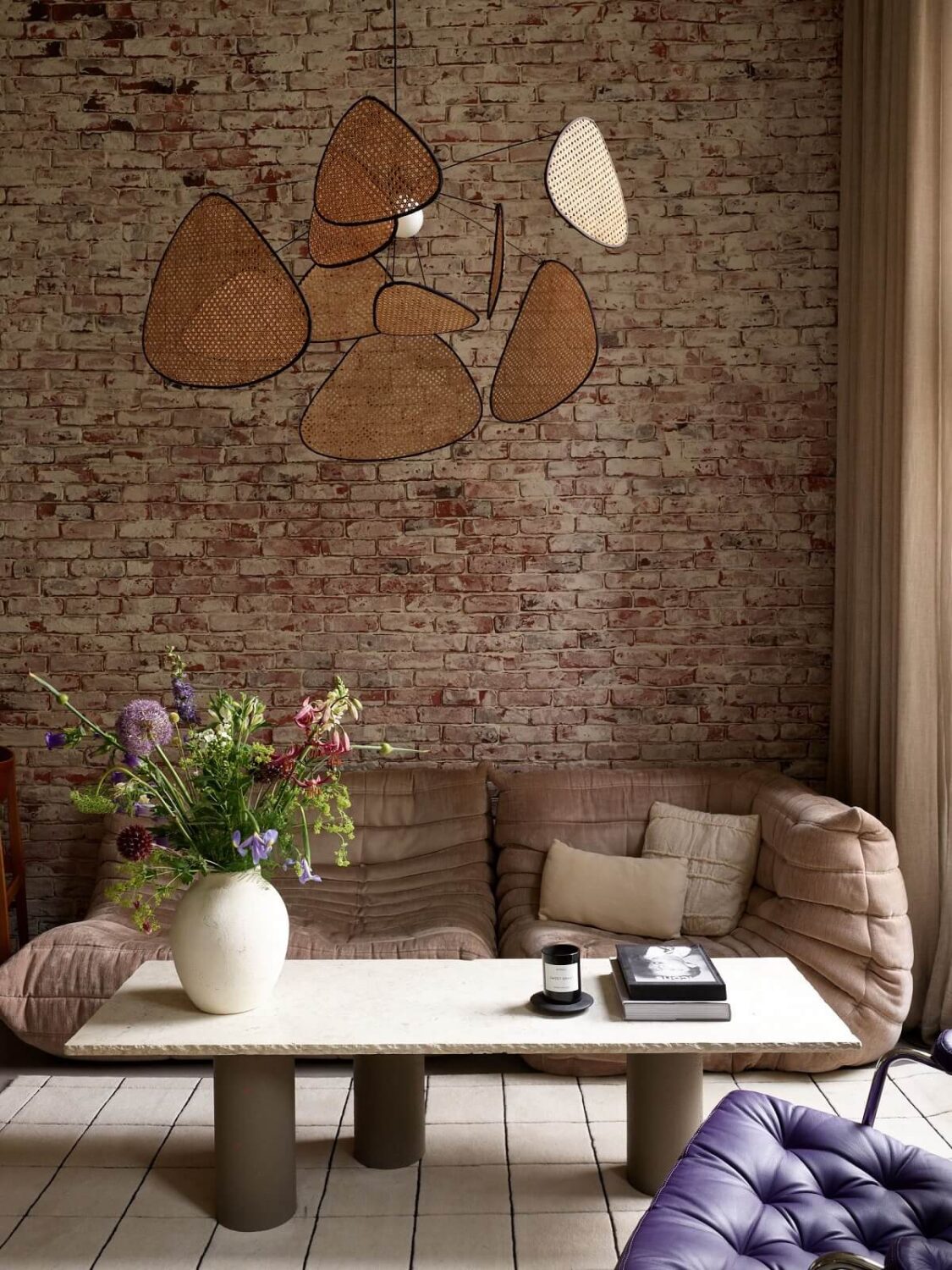 New York Vibes in a Stylish Stockholm Apartment 5 living room brick wall neutral tones