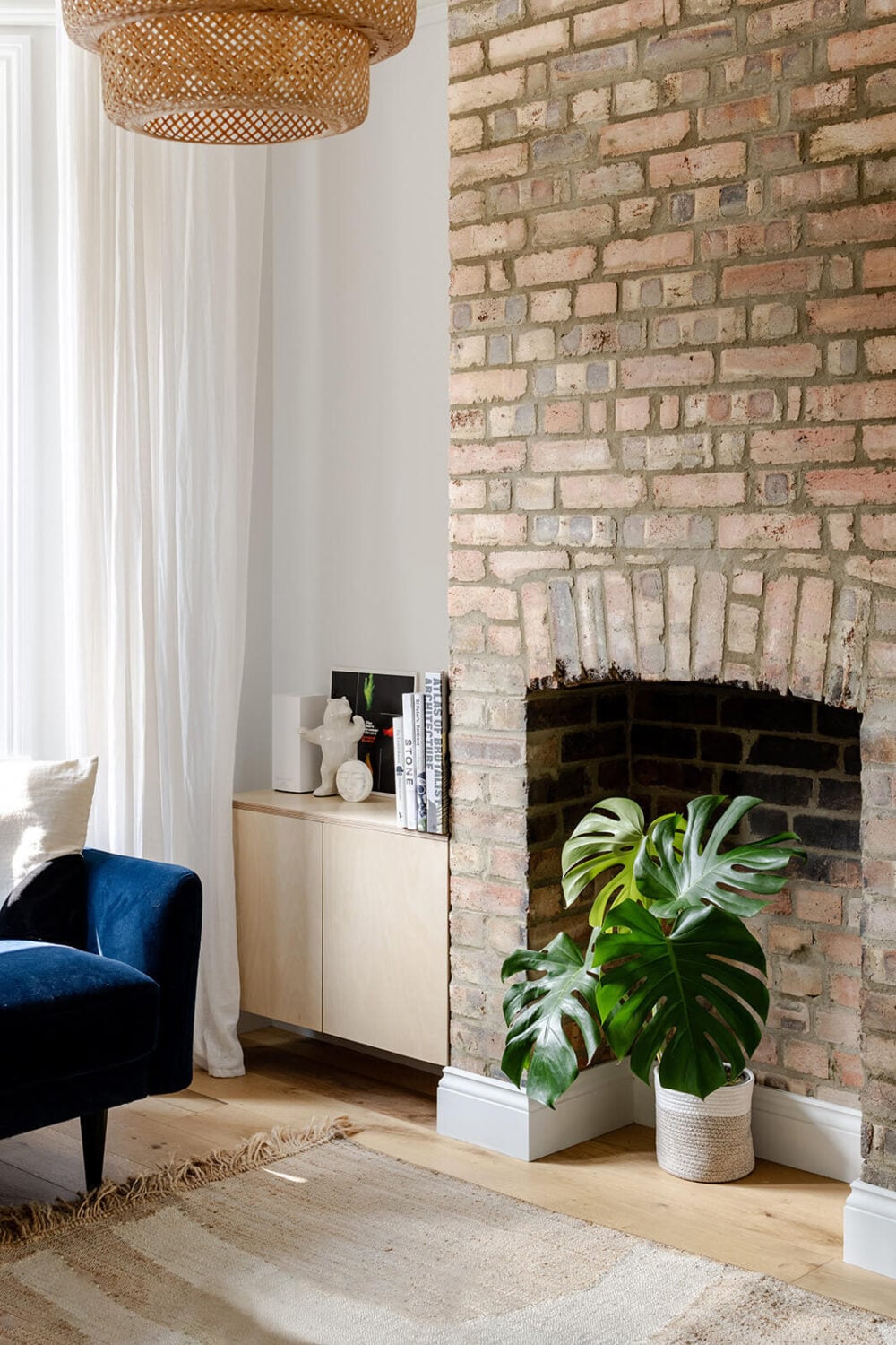A London Terraced House with a Modern Kitchen Extension 3 living room detail brick fireplace