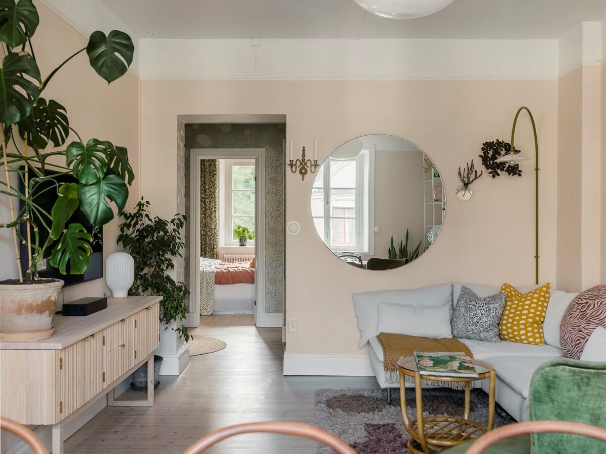 living room pale pink walls round mirror nordroom
