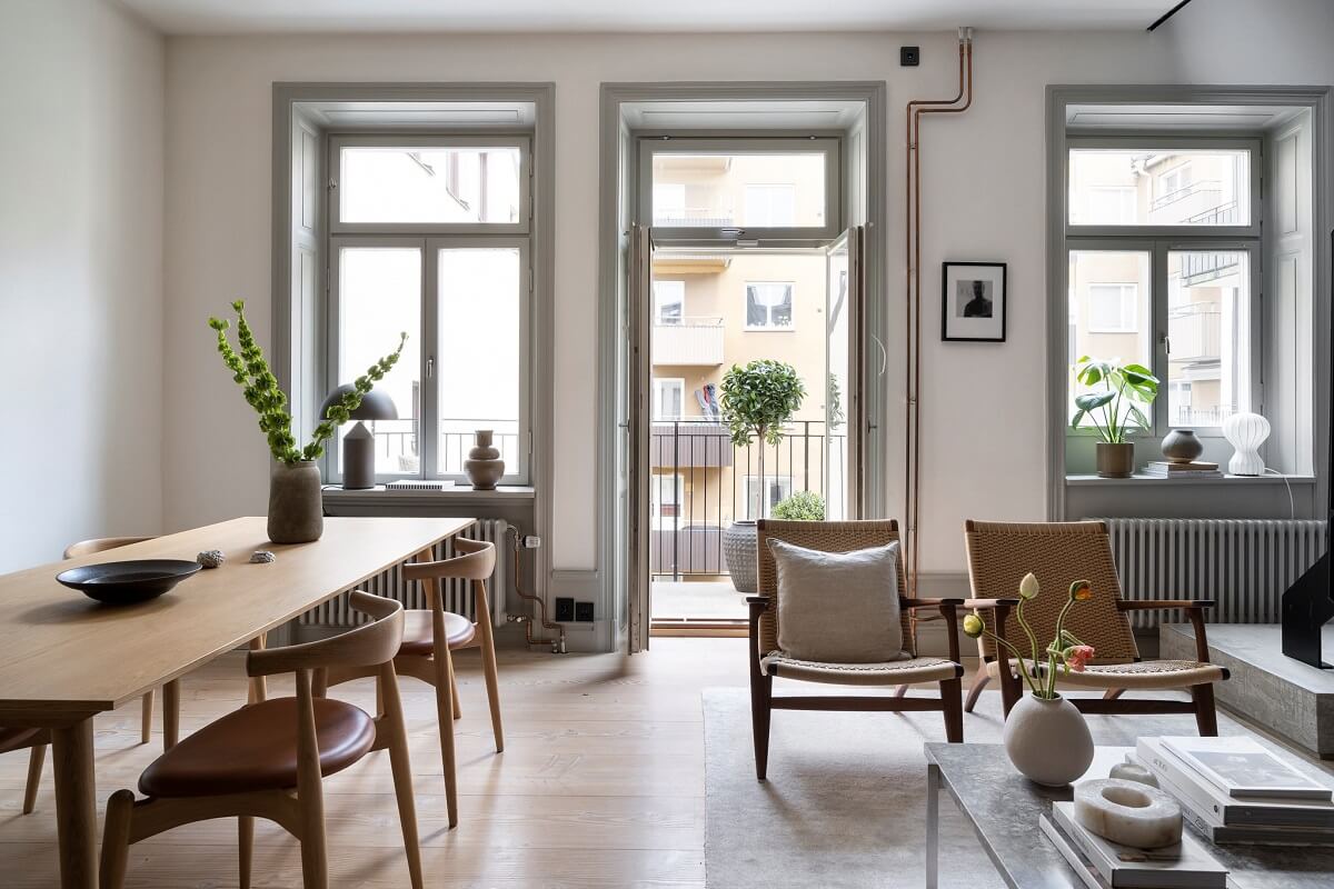 A Stylish Scandinavian Duplex with Custom-Made Cabinets 6 living room with balcony and dining table