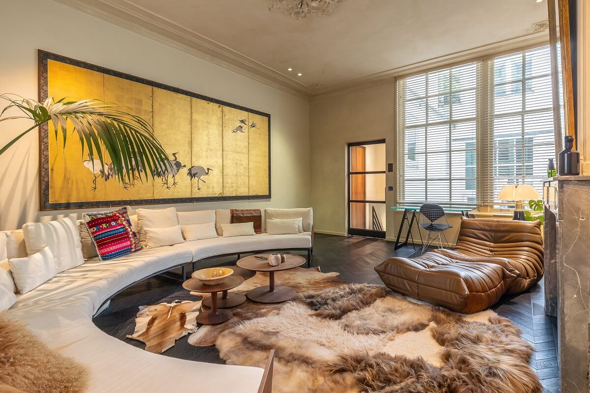 A Luxurious Apartment in an Amsterdam Canal House 16 living room with huge curved sofa