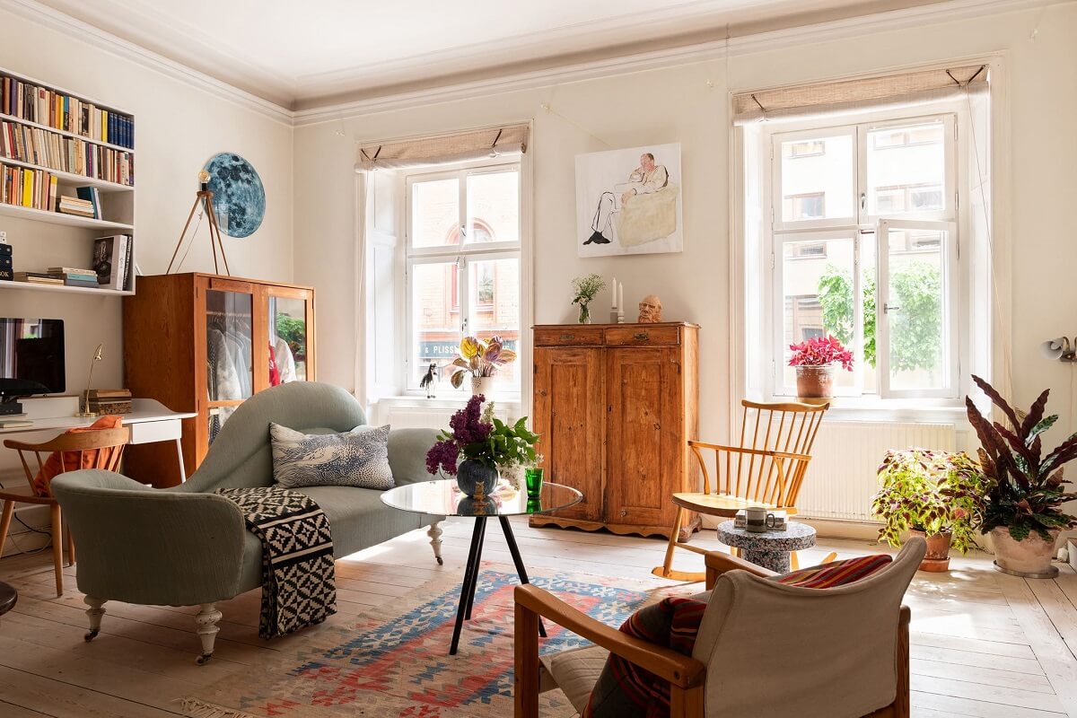 Light and Charming Rooms in a Historic Stockholm Apartment 1 living room with sofa placed in the center of the room