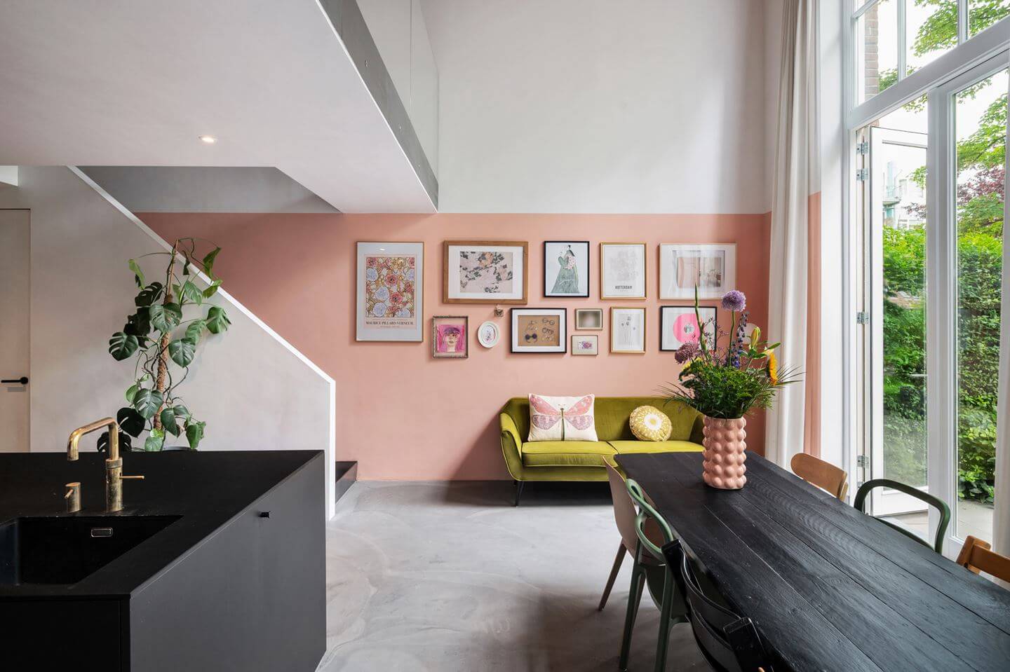 Loft Spaces in a Former School Conversion in Rotterdam 4 living space with half painted pink wall
