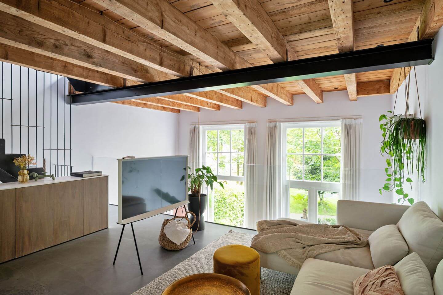 Loft Spaces in a Former School Conversion in Rotterdam 14 loft tv room with wooden ceiling