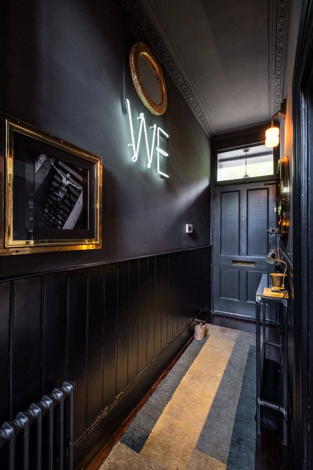 Moody Gray Tones and Period Details in a Victorian Townhouse 8 moody dark gray hallway