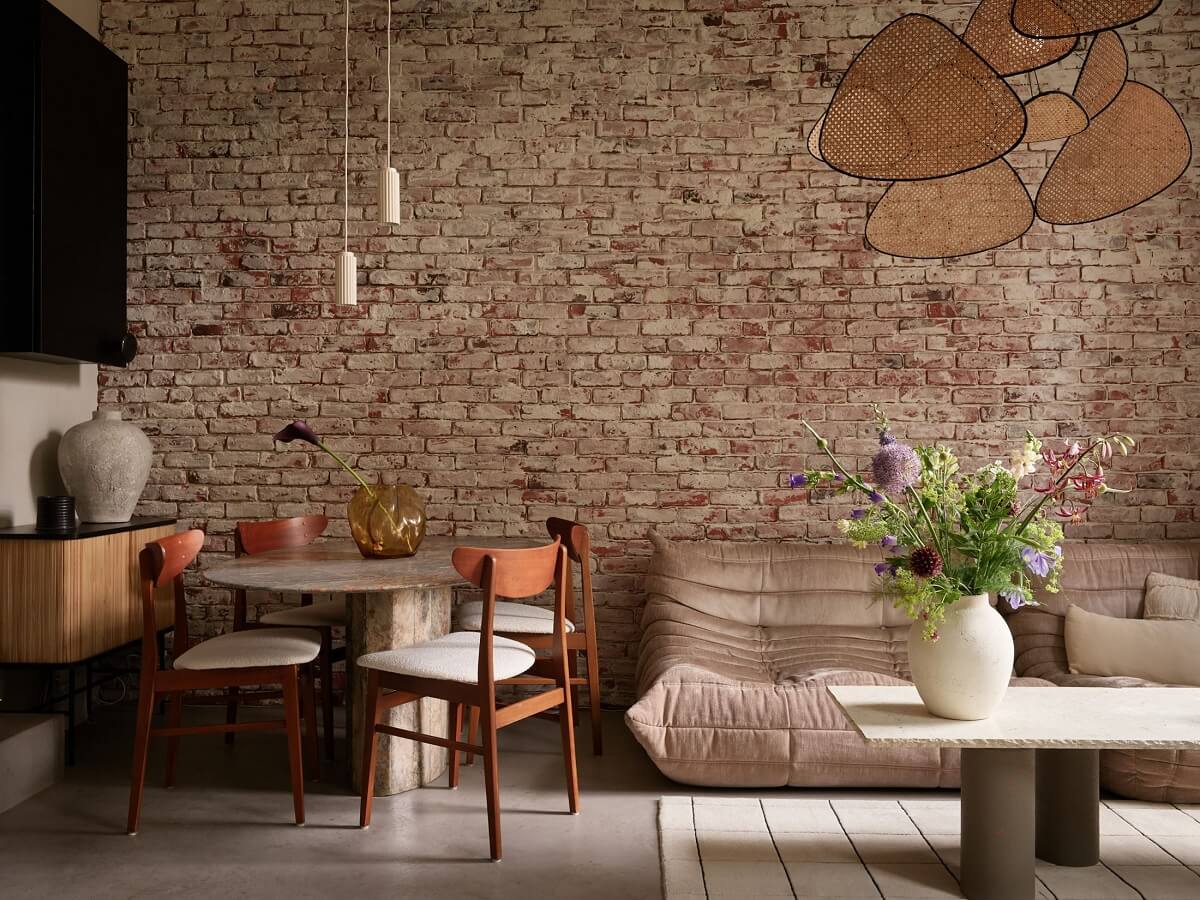 New York Vibes in a Stylish Stockholm Apartment 3 neutral tones living room brick wall