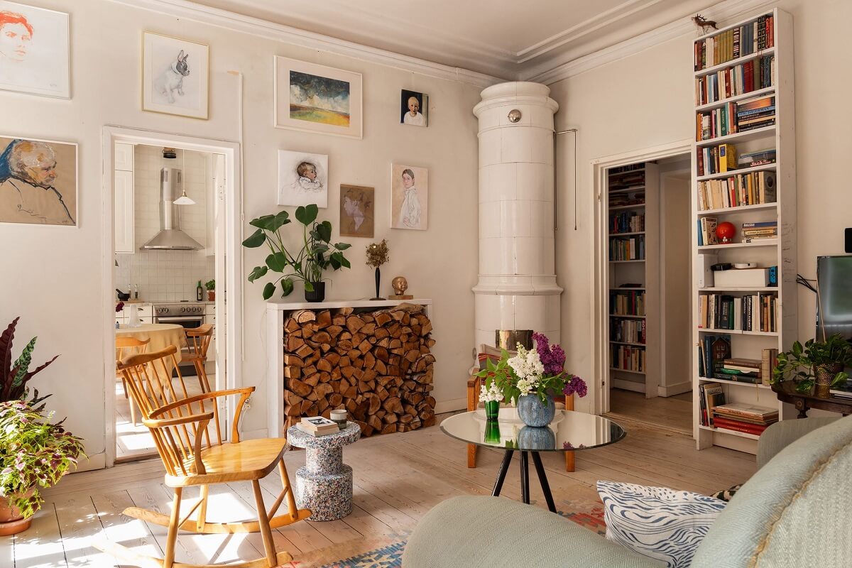 Light and Charming Rooms in a Historic Stockholm Apartment 5 nordic living room with gallery wall and fireplace