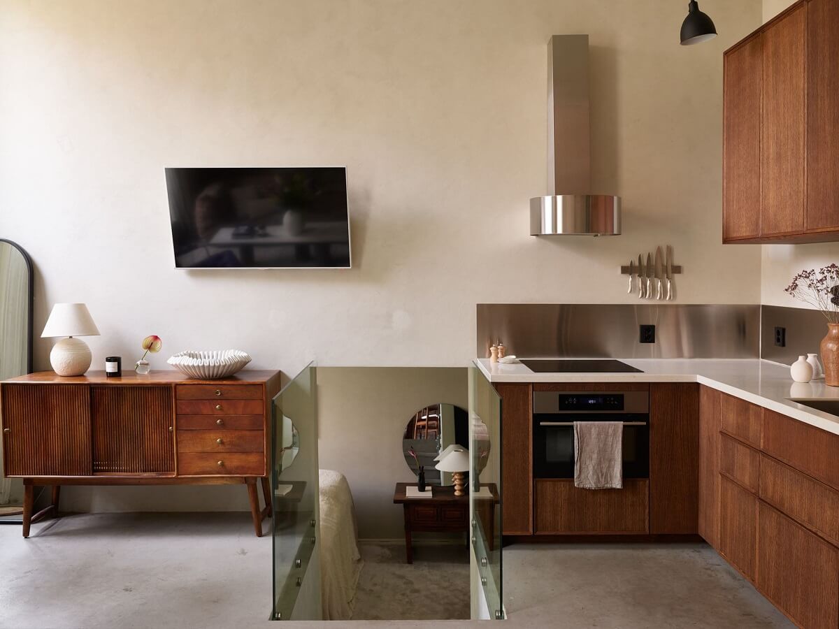 New York Vibes in a Stylish Stockholm Apartment 14 open plan kitchen with wooden cabinets