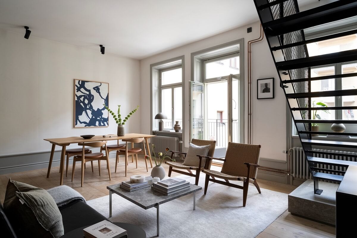 A Stylish Scandinavian Duplex with Custom-Made Cabinets 5 open plan living room dining table