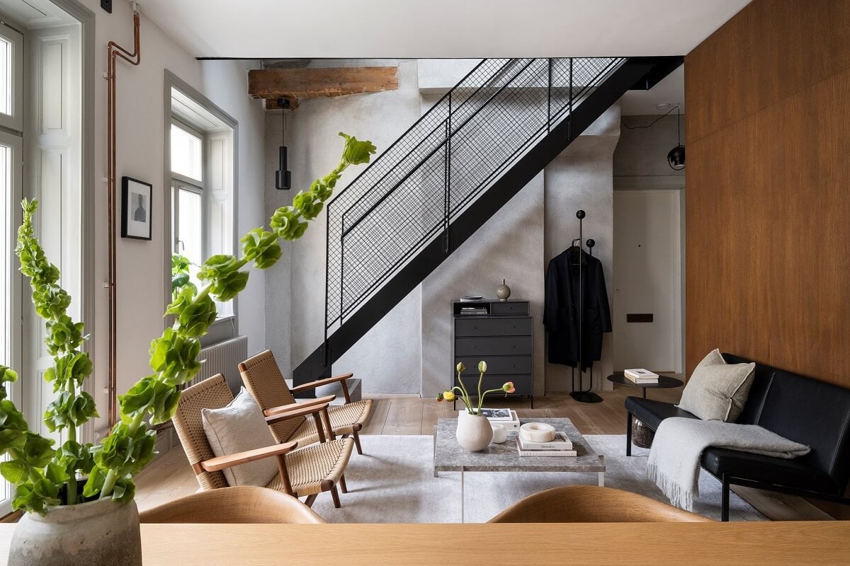 A Stylish Scandinavian Duplex with Custom-Made Cabinets 1 open plan living space with steel staircase