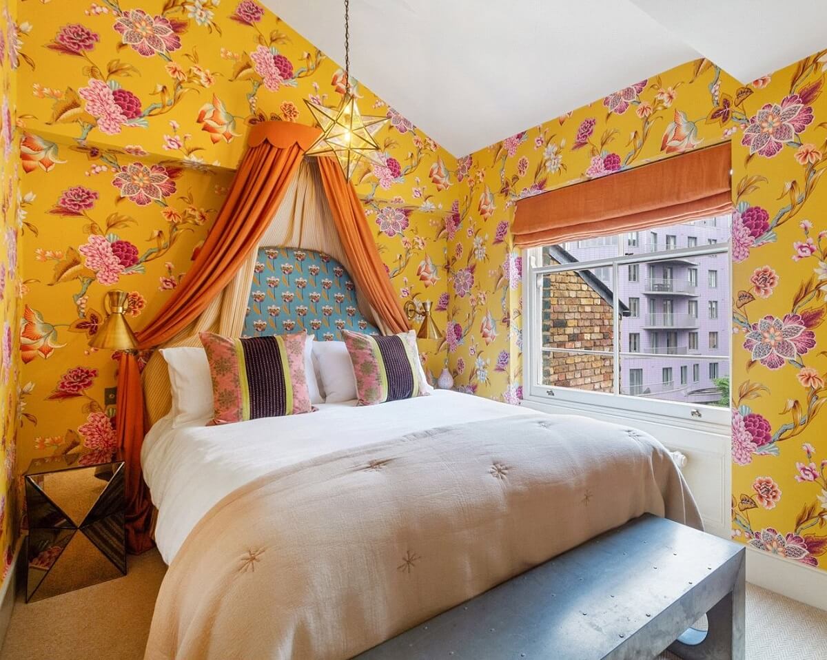 Limewash Paint and Artisan Wallpaper in a London Townhouse 34 pink and yellow floral wallpaper bedroom slanted ceiling nordroom