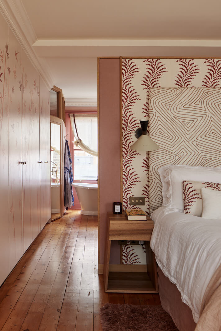 Limewash Paint and Artisan Wallpaper in a London Townhouse 29 pink master bedroom with built in wardrobes