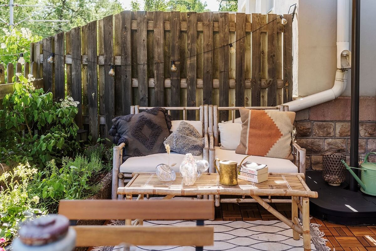 A Charming Studio Apartment with a Loft Bed 14 rattan outdoor sofa