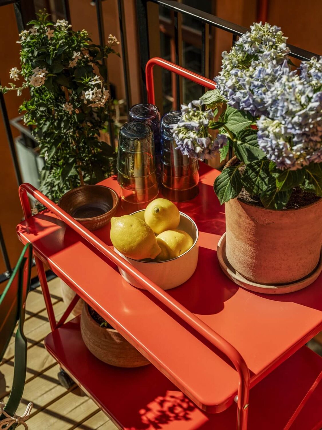A Light Apartment with a Sunny Balcony 19 red storage cabinet balcony