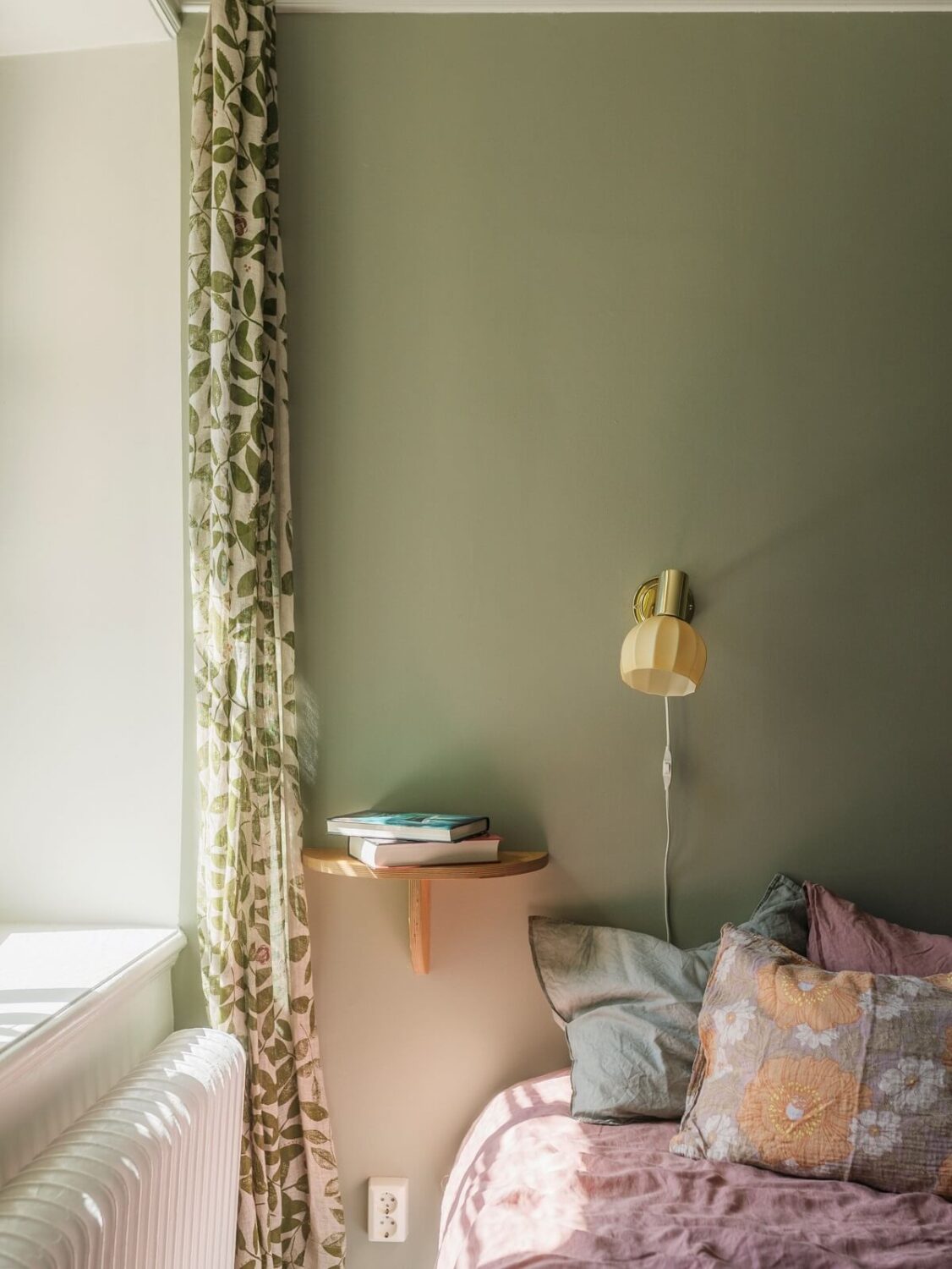 A Light Atmosphere and Wallpapers in a Swedish Apartment 14 sage green bedroom small wall shelf nightstand nordroom