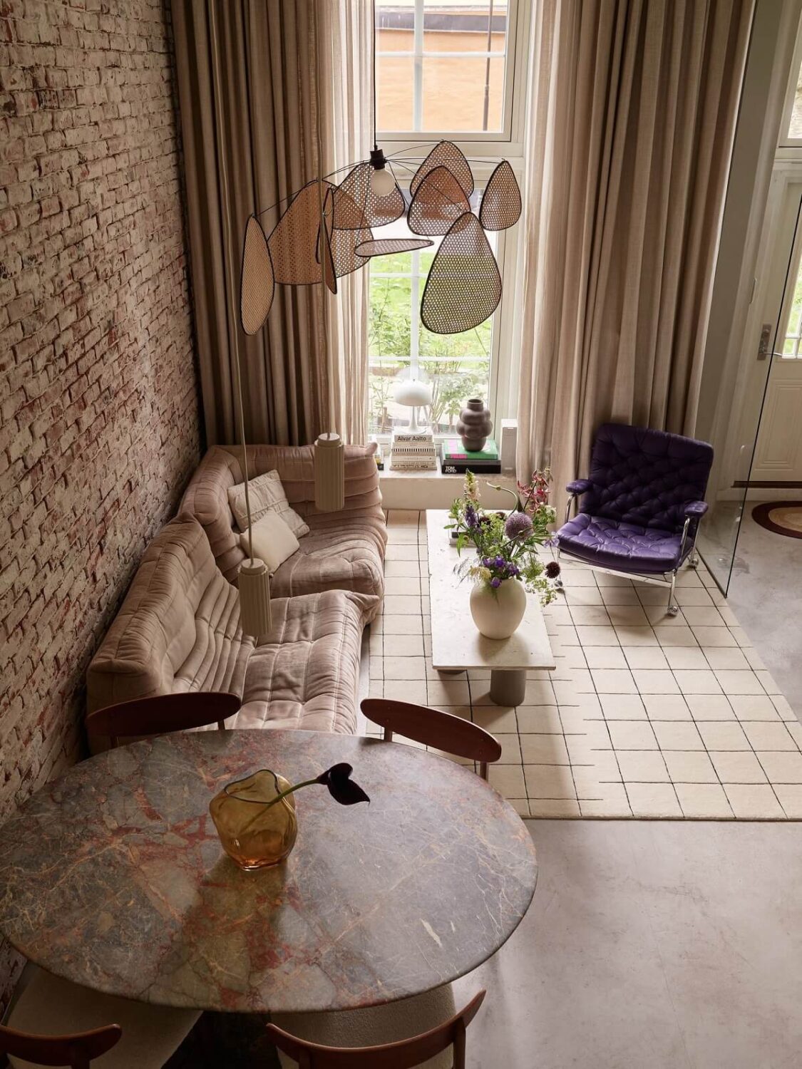 New York Vibes in a Stylish Stockholm Apartment 2 scandi living room brick wall from above