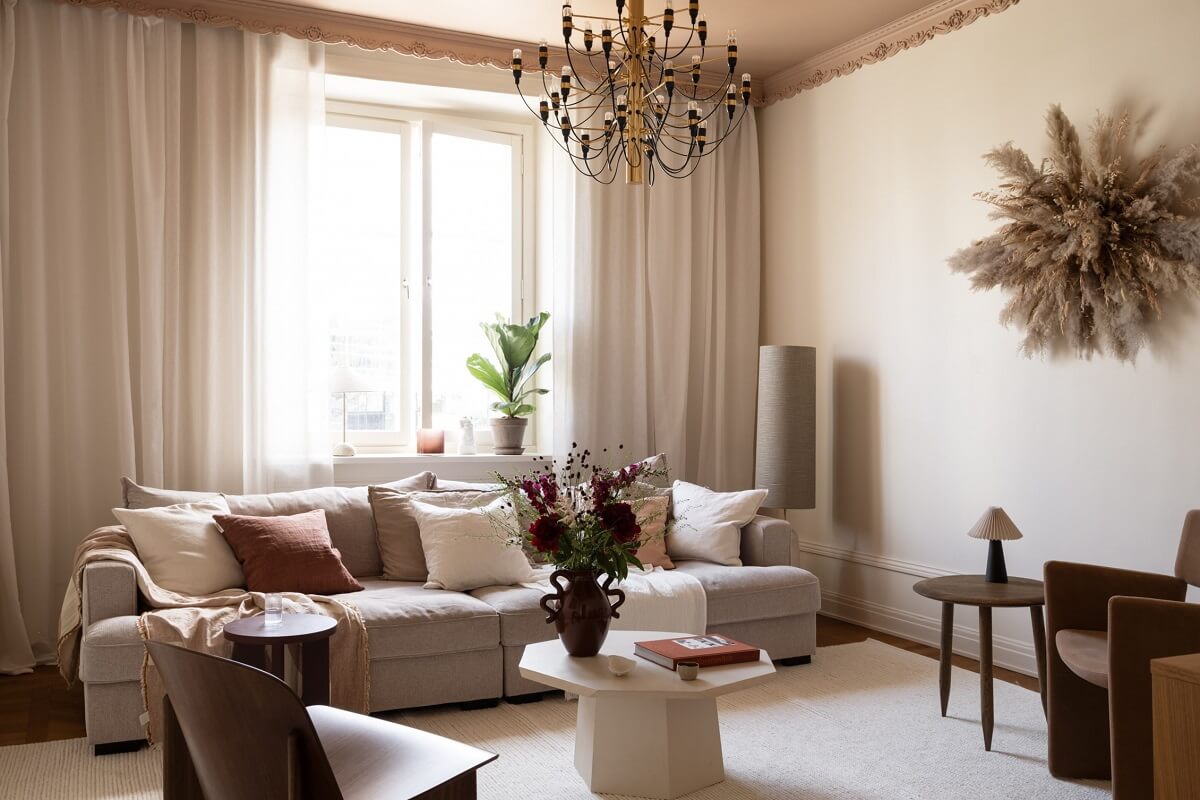 Warm Colors and Painted Ceilings in a Swedish Apartment 2 scandi living room painted ceiling