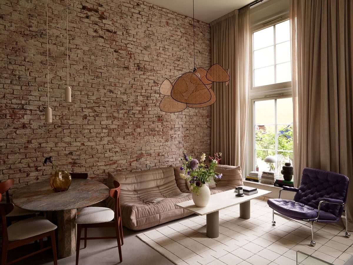 New York Vibes in a Stylish Stockholm Apartment 1 scandi living room with brick wall and high ceilings
