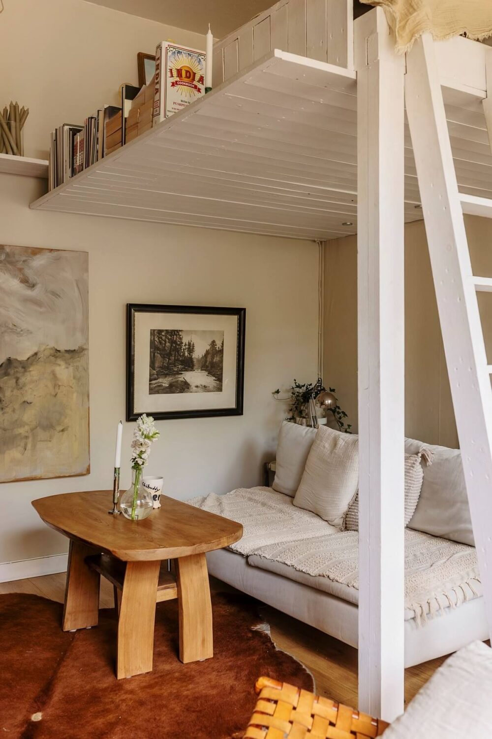 A Charming Studio Apartment with a Loft Bed 3 seating area studio apartment with loft bed