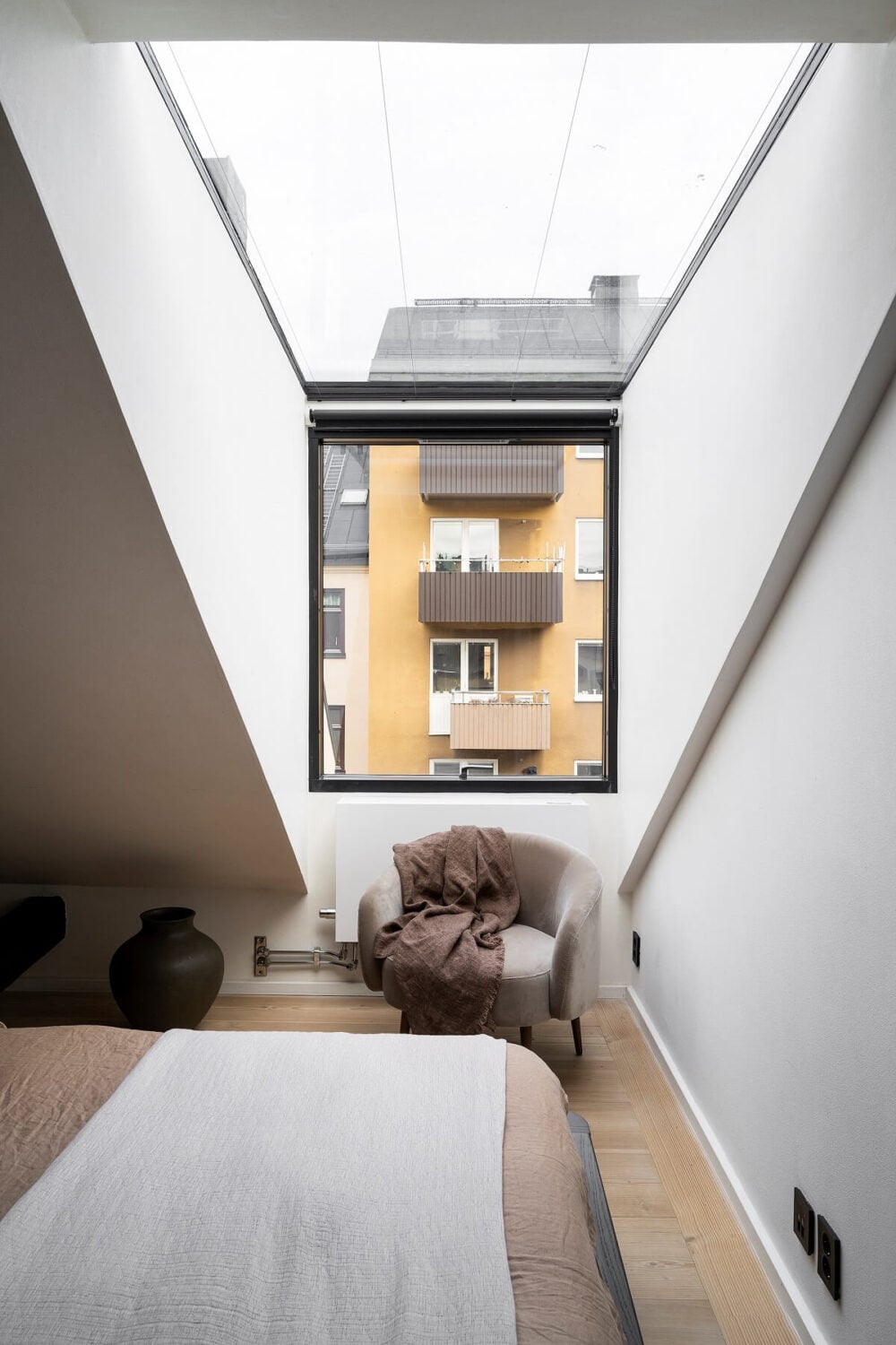 A Stylish Scandinavian Duplex with Custom-Made Cabinets 21 skylight dormer window bedroom