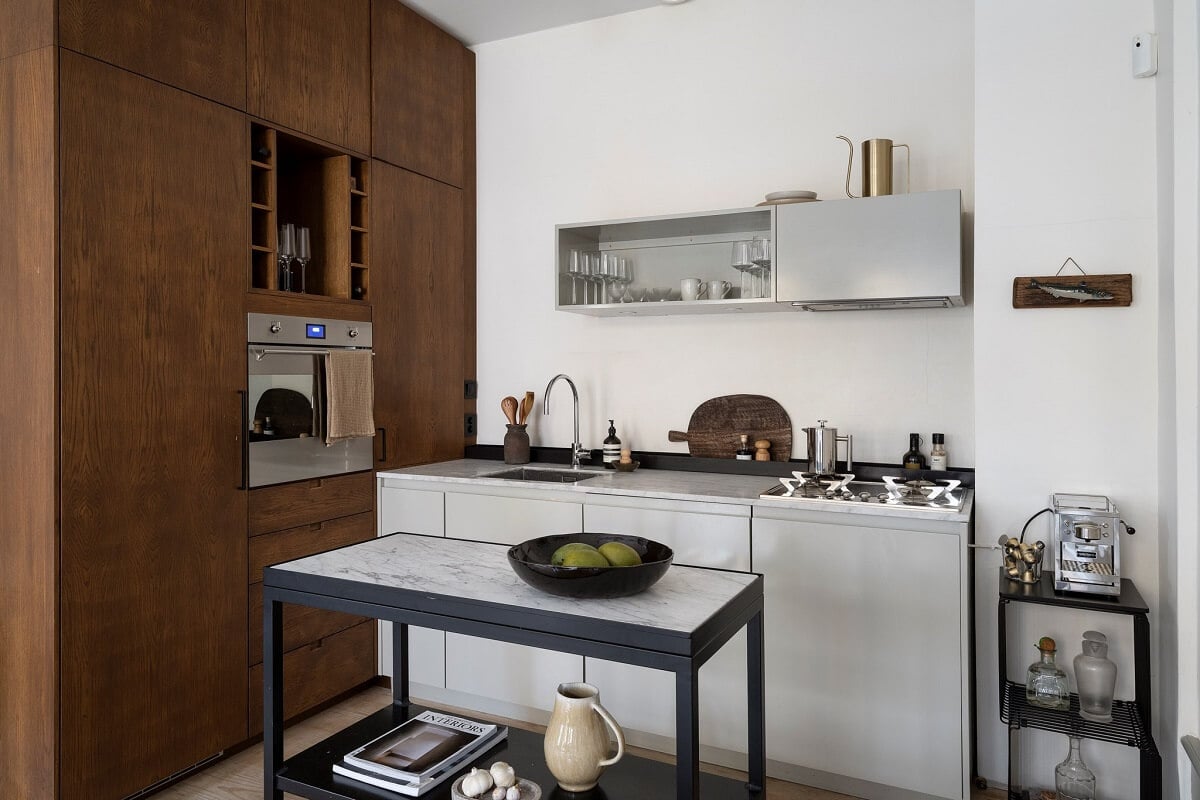 A Stylish Scandinavian Duplex with Custom-Made Cabinets 11 small kitchen with floor to ceiling wooden cabinets