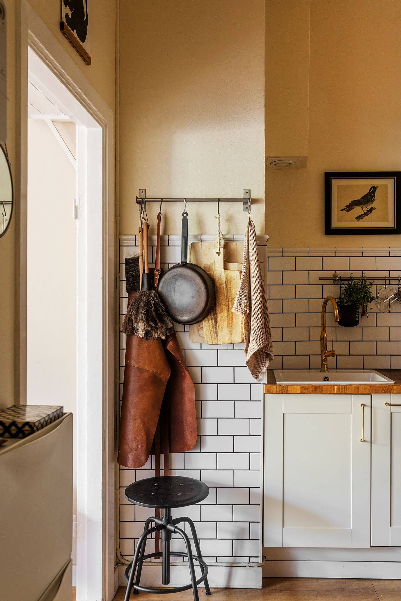 studio apartment kitchen with white subway tiles