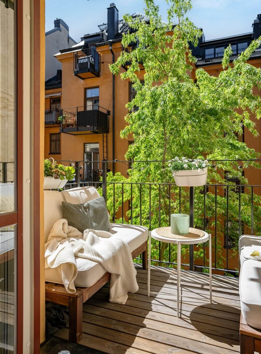 A Small Stockholm Apartment with a Gray Bedroom & Sunny Balcony 14 sunny courtyard balcony
