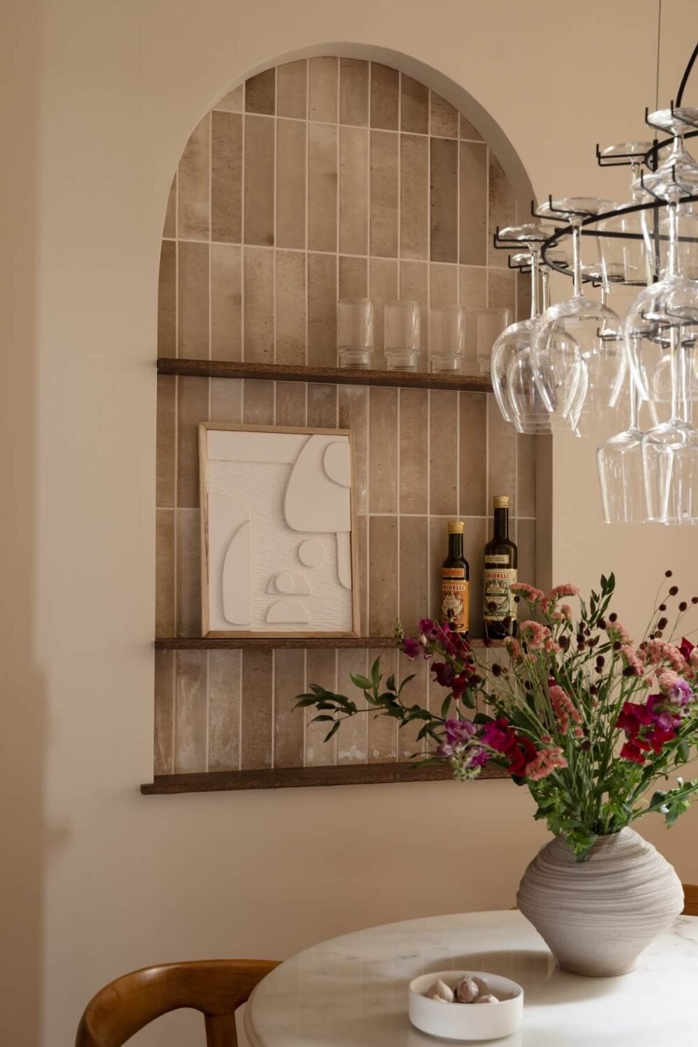 Warm Colors and Painted Ceilings in a Swedish Apartment 6 tiled arched niche with shelves nordroom