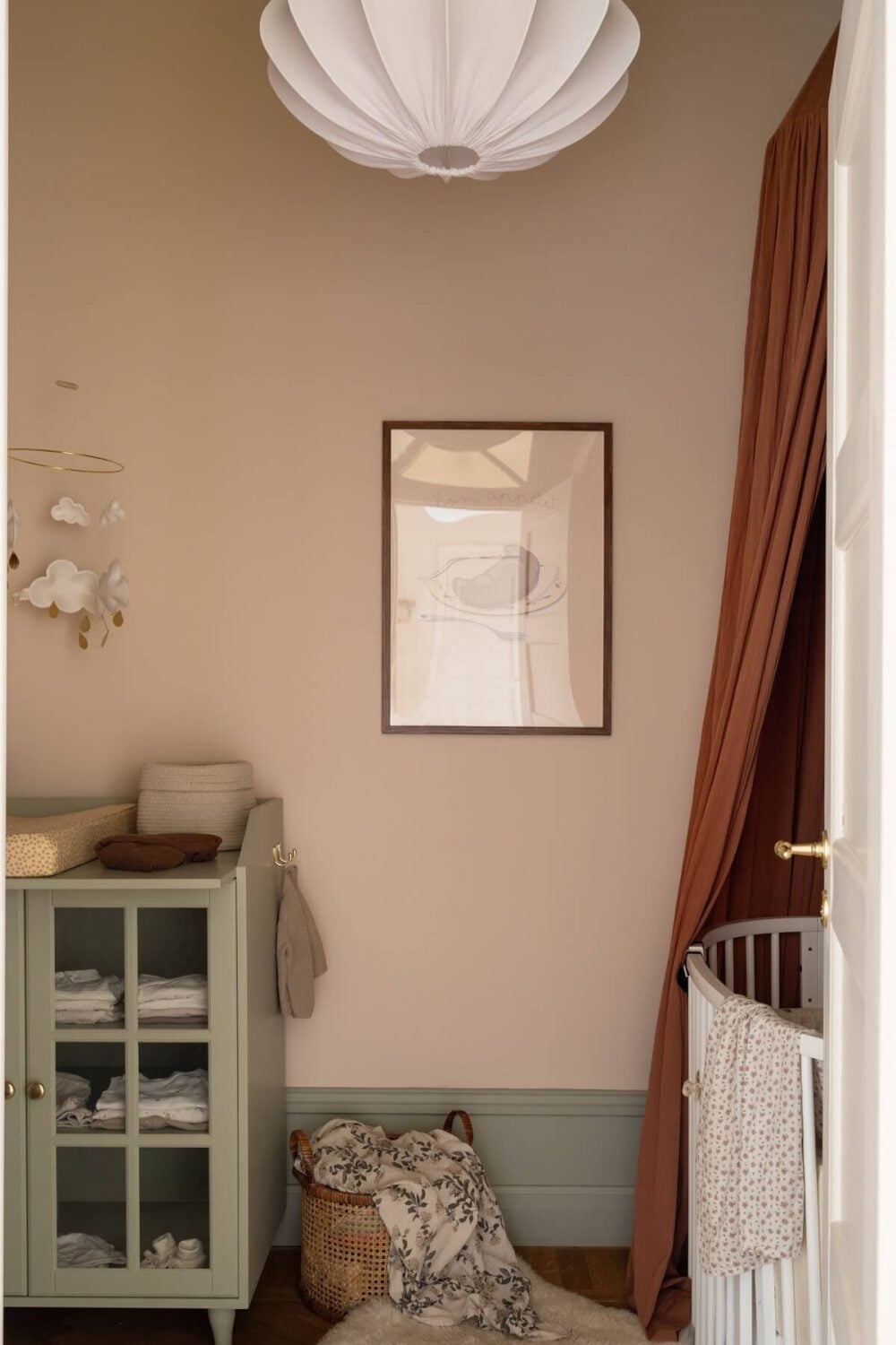 Warm Colors and Painted Ceilings in a Swedish Apartment 21 tiny nursery with pink walls nordroom