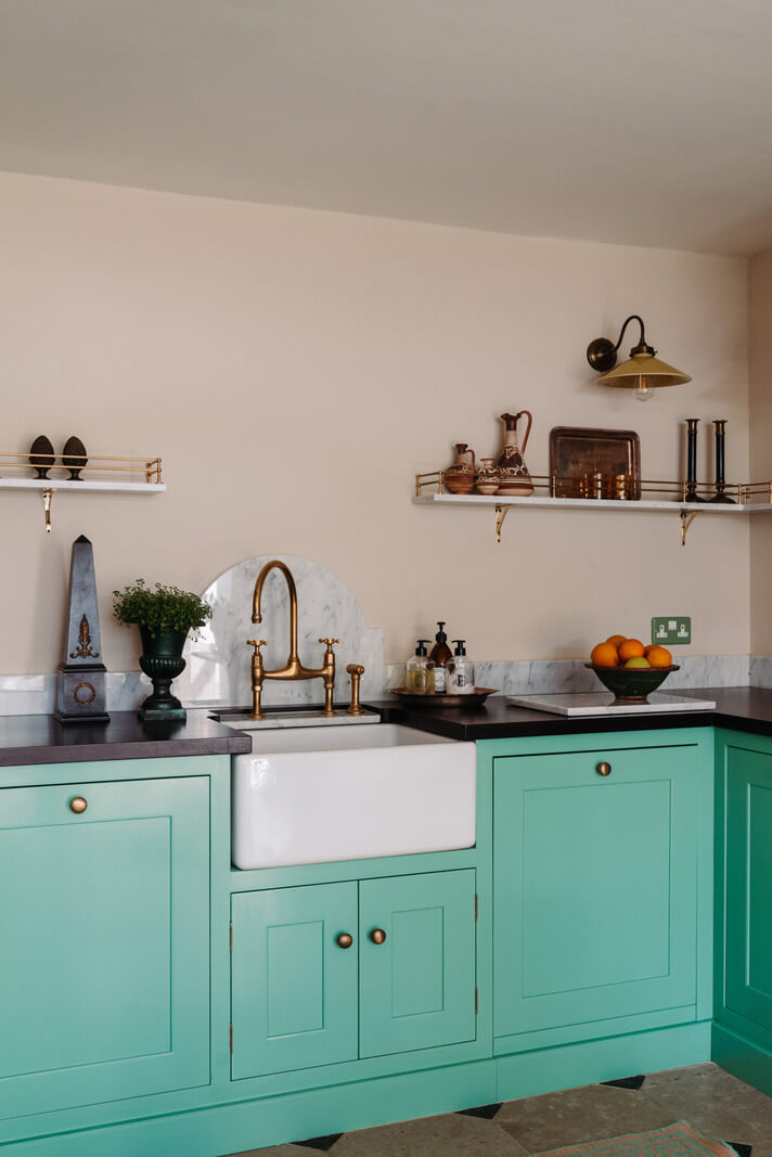 Rich Colors and Patterns in a London Townhouse 9 turquoise kitchen with butler sink and shelves