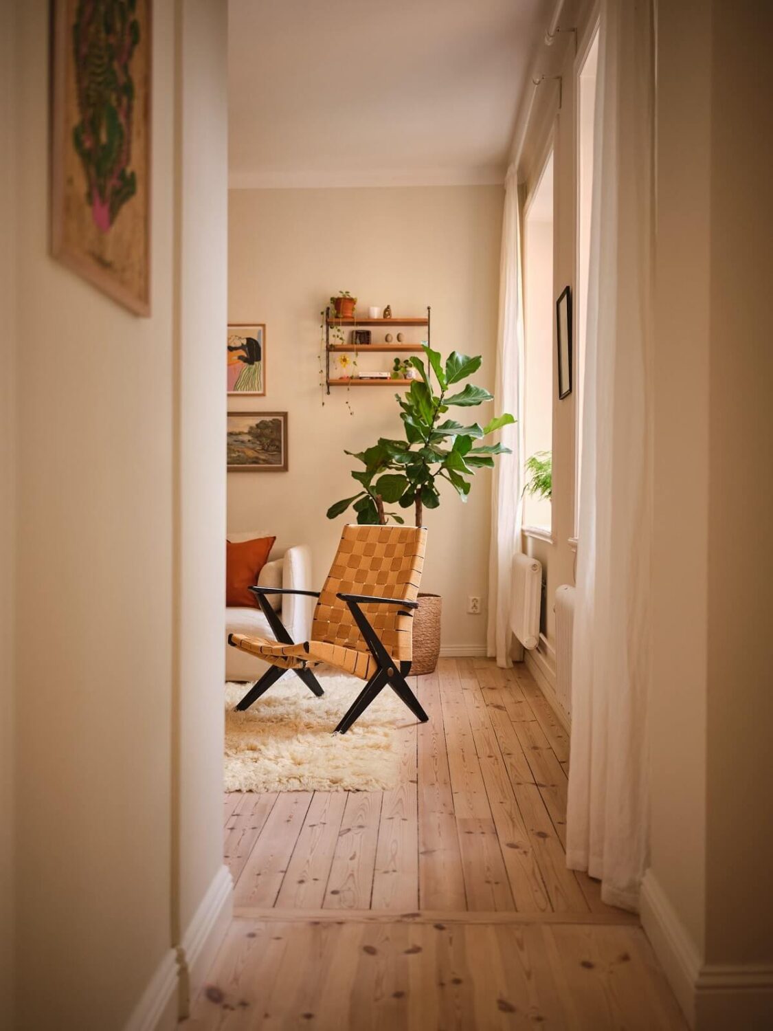 A Light Apartment with a Sage Green Kitchen 4 view into living room A Light Apartment with a Sage Green Kitchen