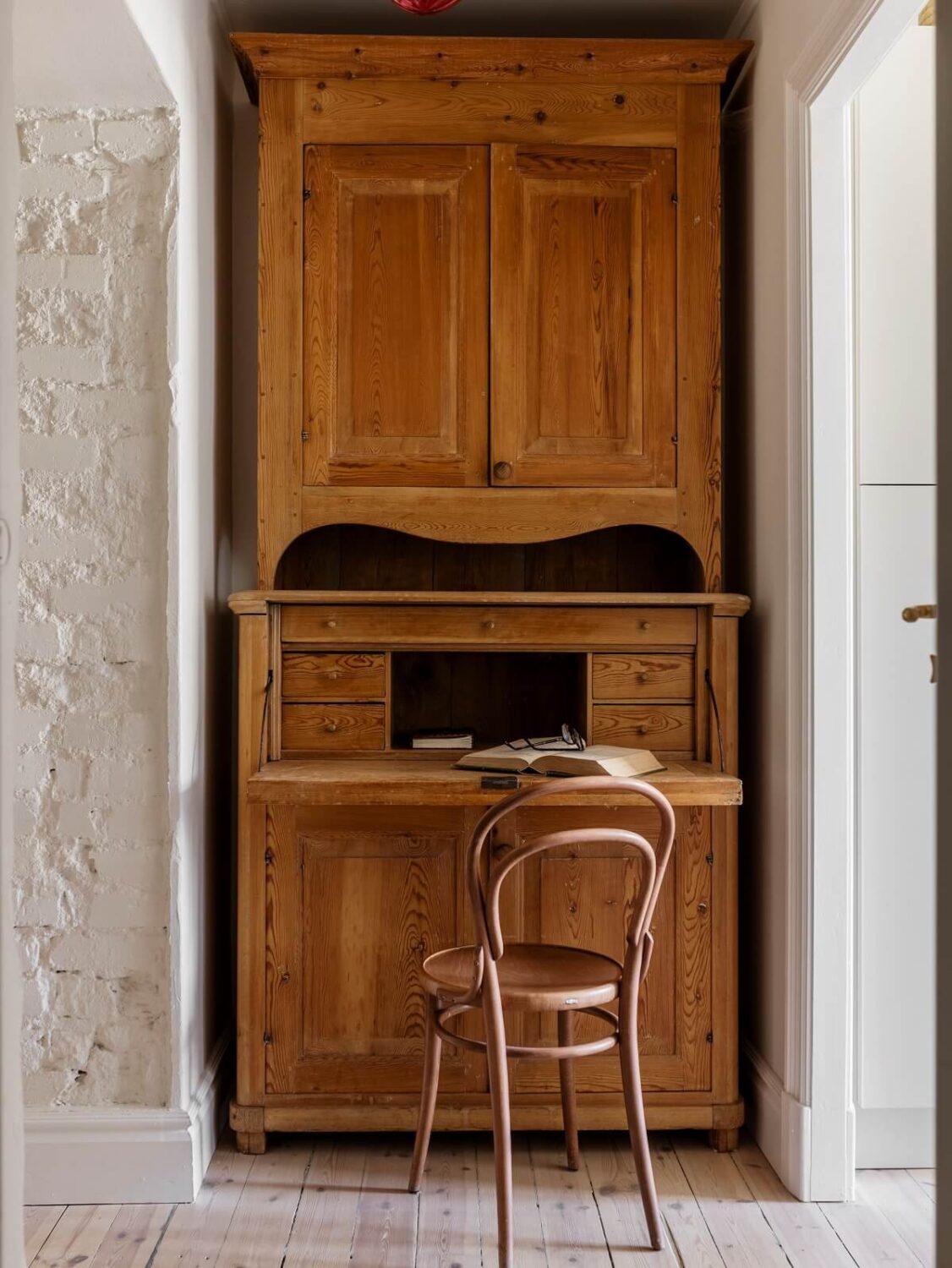 A Light Atmosphere and Wallpapers in a Swedish Apartment 23 vintage desk in nook