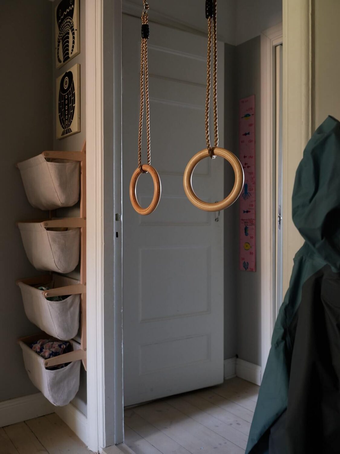 A Cozy Attic Apartment is a Charming Family Home 25 wall mounted storage baskets