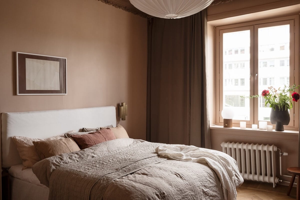 Warm Colors and Painted Ceilings in a Swedish Apartment 12 warm scandinavian bedroom