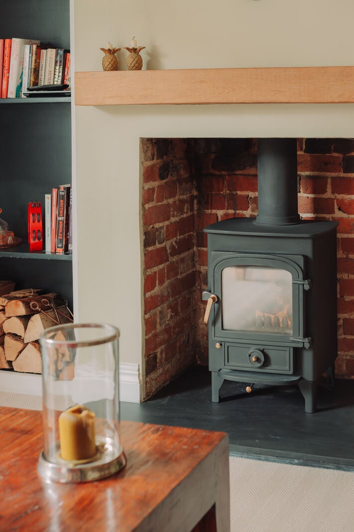 Colorful Rooms in an Elegant Georgian Home in England 4 wood burner in brick fireplace