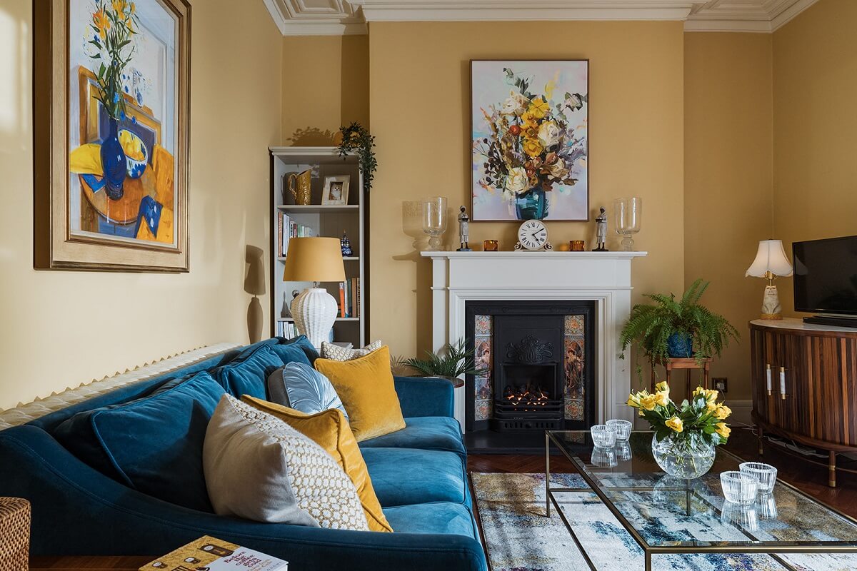 Colorful Interiors and Wallpapers in a Victorian House 3 yellow living room with blue sofa