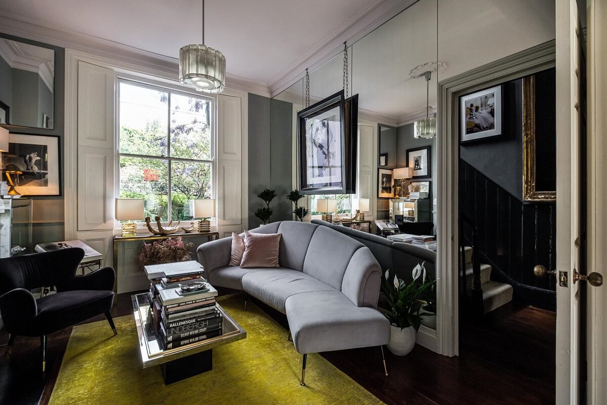 Moody Gray Tones and Period Details in a Victorian Townhouse 3 yellow rug gray sitting room