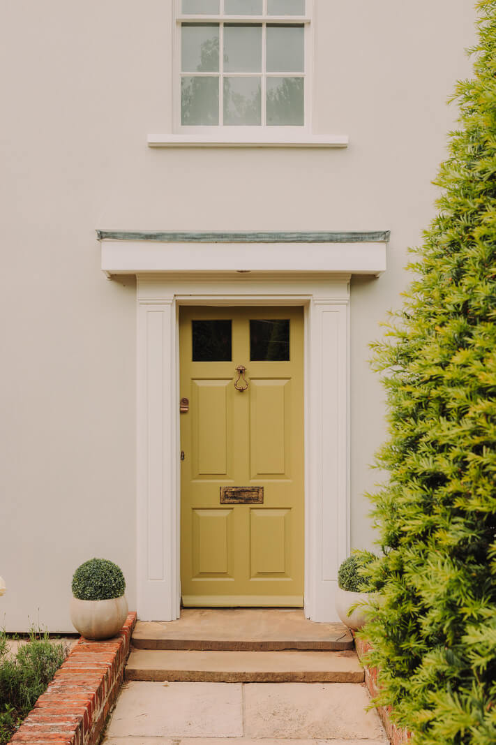 Colorful Rooms in an Elegant Georgian Home in England 24 yellowfront door