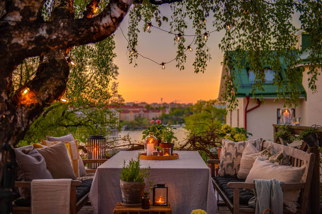 A White Apartment Features a Beautiful Terrace with a View 16 apartment terrace evening view