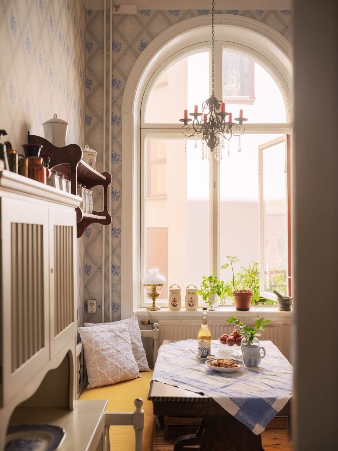 Antique Furniture and Arched Windows in a Stockholm Apartment 11 arched kitchen window