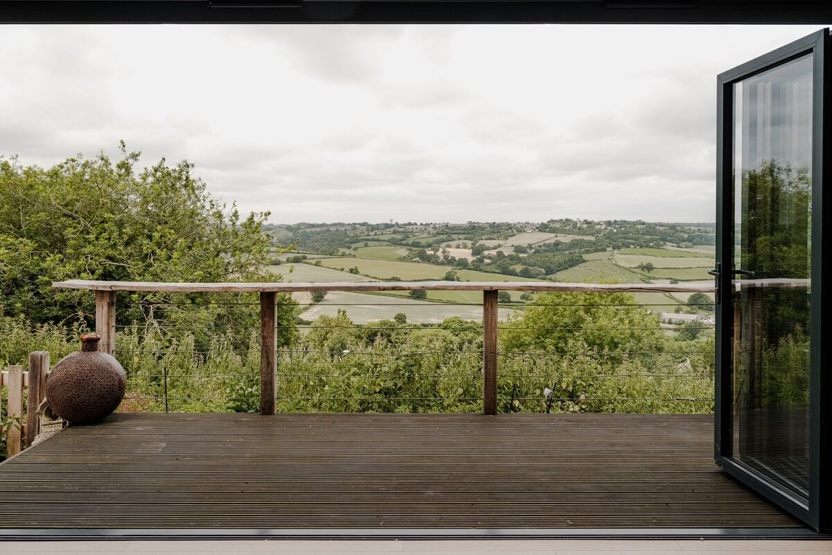 A Black Barn House with Boho Interiors and Breathtaking Views 5 balcony
