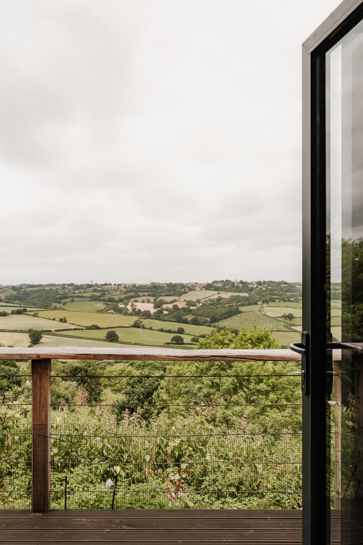 A Black Barn House with Boho Interiors and Breathtaking Views 13 balcony view