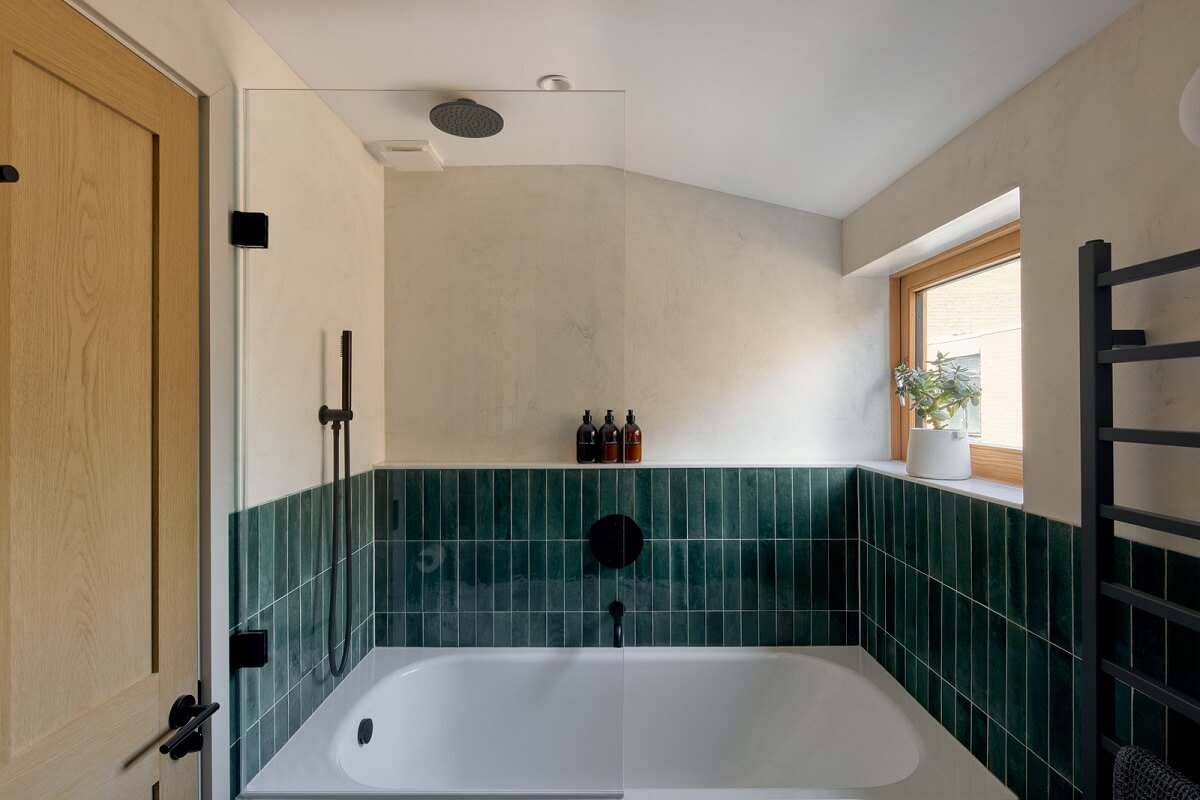 Douglas Fir and Natural Materials in a London Home 26 bath with green tiles