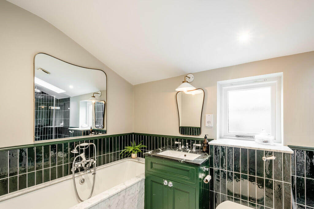 An Open Plan Victorian House with a Lush Green Garden 10 bathroom green tiles An Open Plan Victorian House with a Lush Green Garden