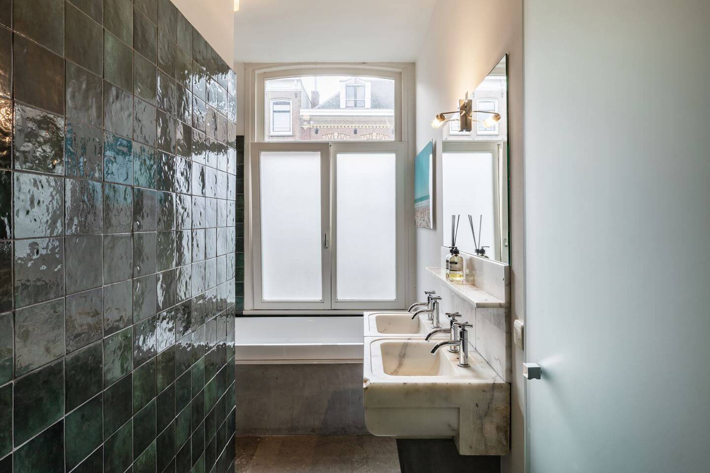 A Beautiful Renovated Duplex Apartment in Amsterdam 21 bathroom green tiles