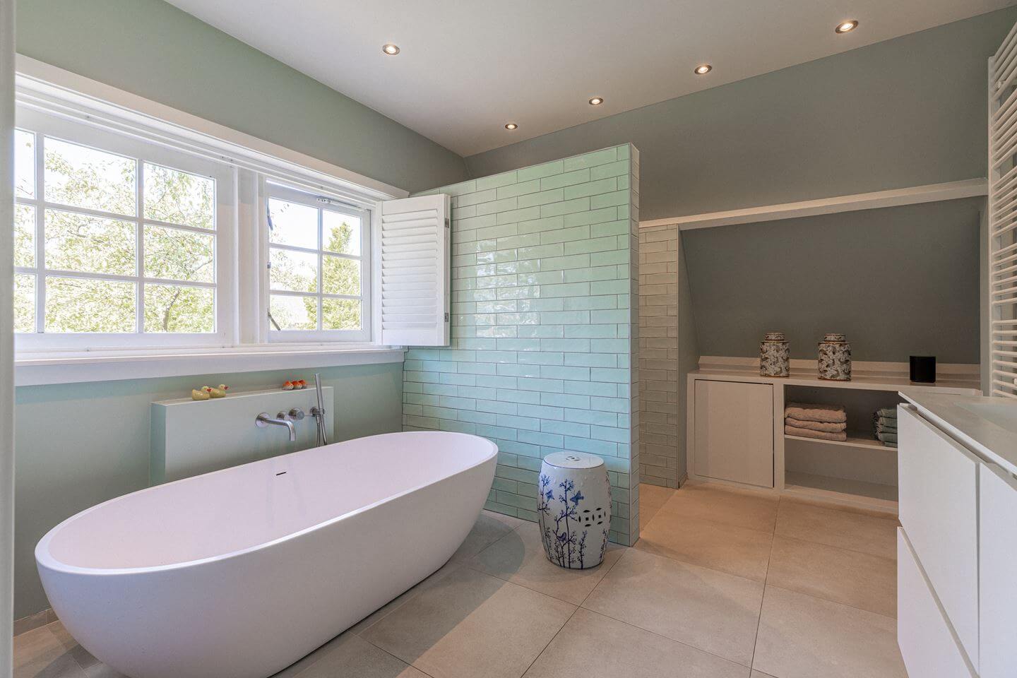 Bold Color Accents in a Dutch Family Home 21 bathroom light green blue tiles
